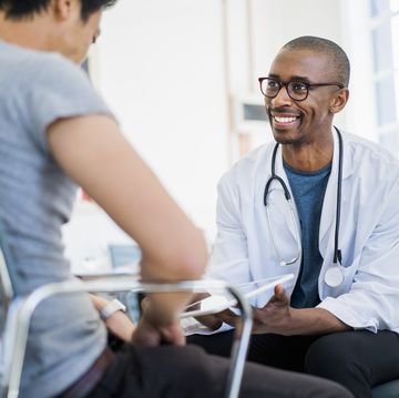 doctor showing results to patient in hospital