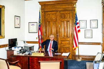 a person standing at a podium