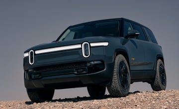 electric suv parked on rocky terrain