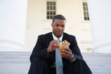 man not excited about a sandwich