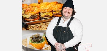 a woman holding a tray of food