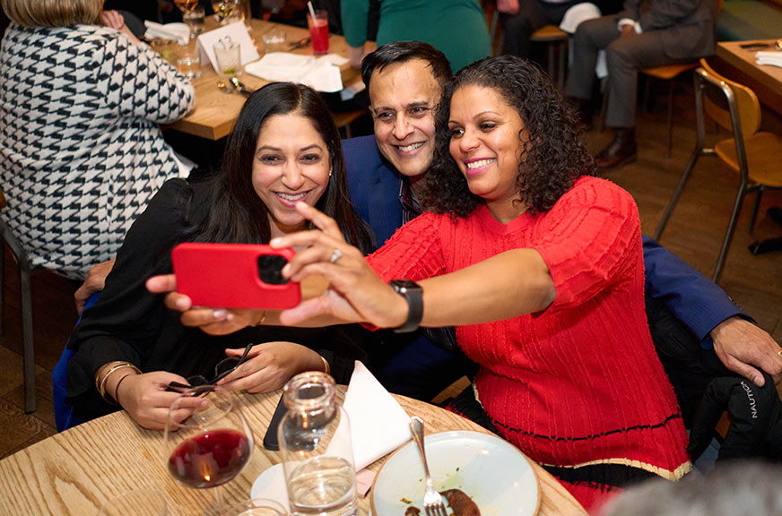 adimika arthur and colleagues taking a selfie at an event