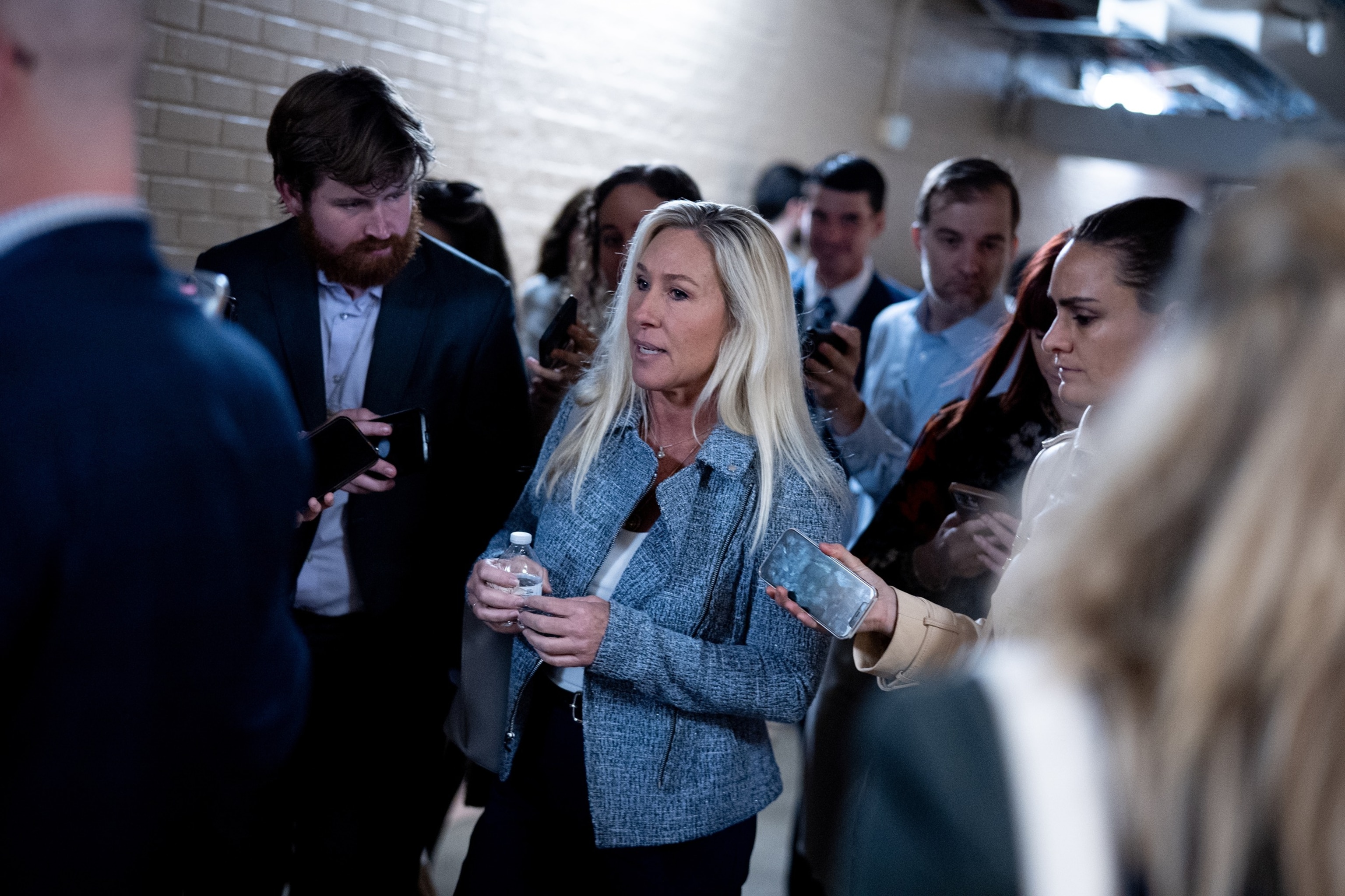 PHOTO: Rep. Marjorie Taylor Greene speaks to reporters as she leaves a House Republican Caucus meeting on Capitol Hill on Nov.  19, 2024 in Washington, DC.