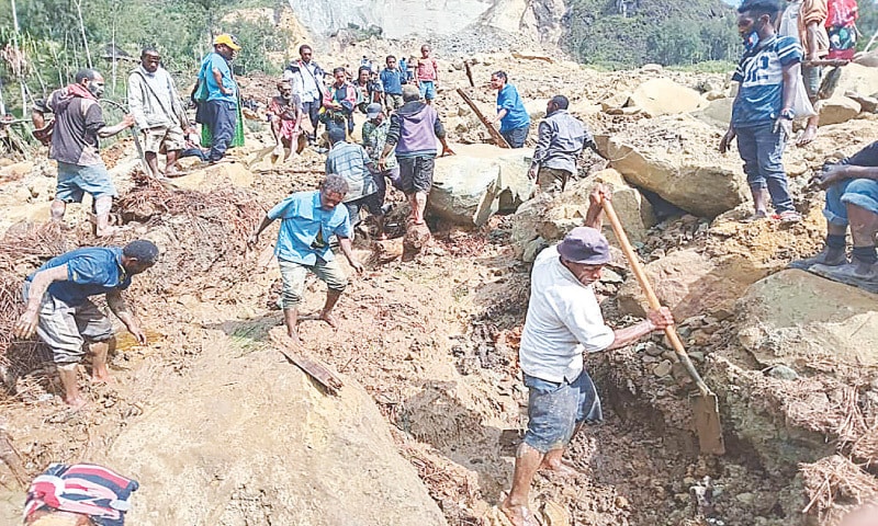 People dig at the site of a landslide at Yambali Village in Papua New Guinea’s Enga province.—AFP