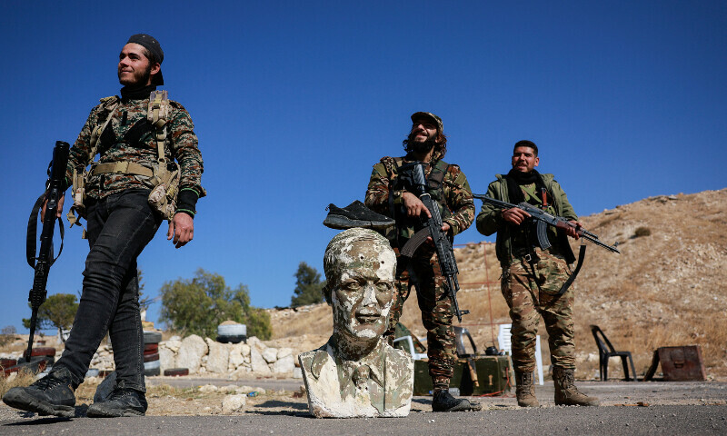 A shoe rests on top of a bust of former Syrian president Hafez al-Assad, as fighters of the ruling Syrian body inspect the damage at a military site, in the aftermath of an Israeli strike according to Syrian Observatory for Human Rights, after fighters of the ruling Syrian body ousted Syria’s Bashar al-Assad, in Damascus, Syria on December 14. — Reuters