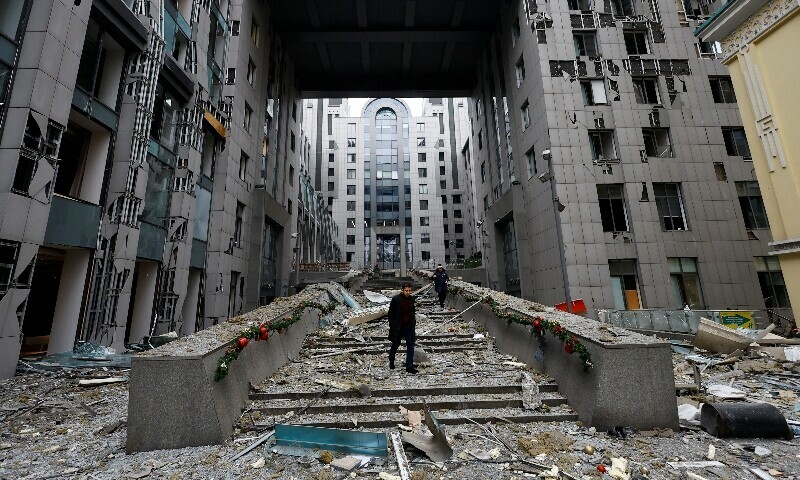 People walk at the site of a Russian missile strike, amid Russia’s attack on Ukraine, in central Kyiv, Ukraine, December 20, 2024. — Reuters