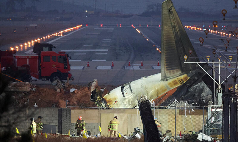 Rescuers work near the wreckage of the Jeju Air aircraft that went off the runway and crashed at Muan International Airport, in Muan, South Korea, December 30. — Reuters