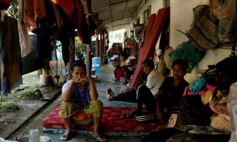 People sit inside a relief camp for displaced Meiteis after their homes and shops were set ablaze, in Borobekra, Jiribam in the northeastern state of Manipur, India, November 23. — Reuters