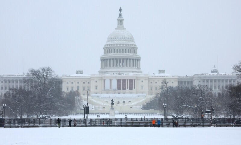 A security fencing which encircles the US Capitol building is pictured, as a winter storm that brought snow, ice and freezing temperatures to a broad swathe of the US hits Washington, US, January 6. — Reuters