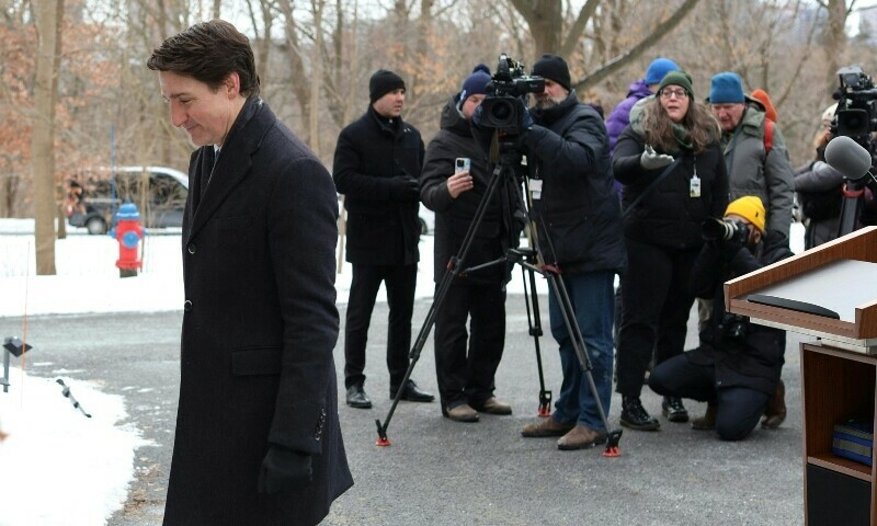 Canadian Prime Minister Justin Trudeau leaves after speaking at a news conference at Rideau Cottage in Ottawa, Canada on January 6. — AFP