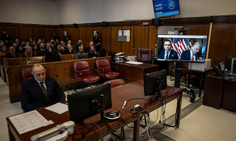 Attorney Emil Bove listens as Attorney Todd Blanche and President-elect Donald Trump, seen on a television screen, appear virtually for sentencing at the Manhattan criminal court, New York, US on Friday. — Reuters