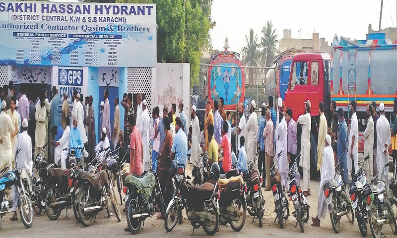  Residents line up outside a water hydrant in the Sakhi Hassan neighbourhood to get their names registered for water tanker deliveries: Karachi’s rapidly increasing population is quickly widening the gap between water demand and supply | White Star 