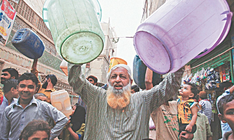  A man holds empty buckets during a protest against water shortage in the city: due to states’ inability to adequately provide its citizens with water, the number of illegal hydrants is increasing and many apartment complexes have installed their own tube wells | AP 