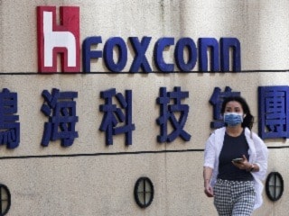 Foxconn, Dixon Said to Urge Government to Pay Pending Production Subsidies