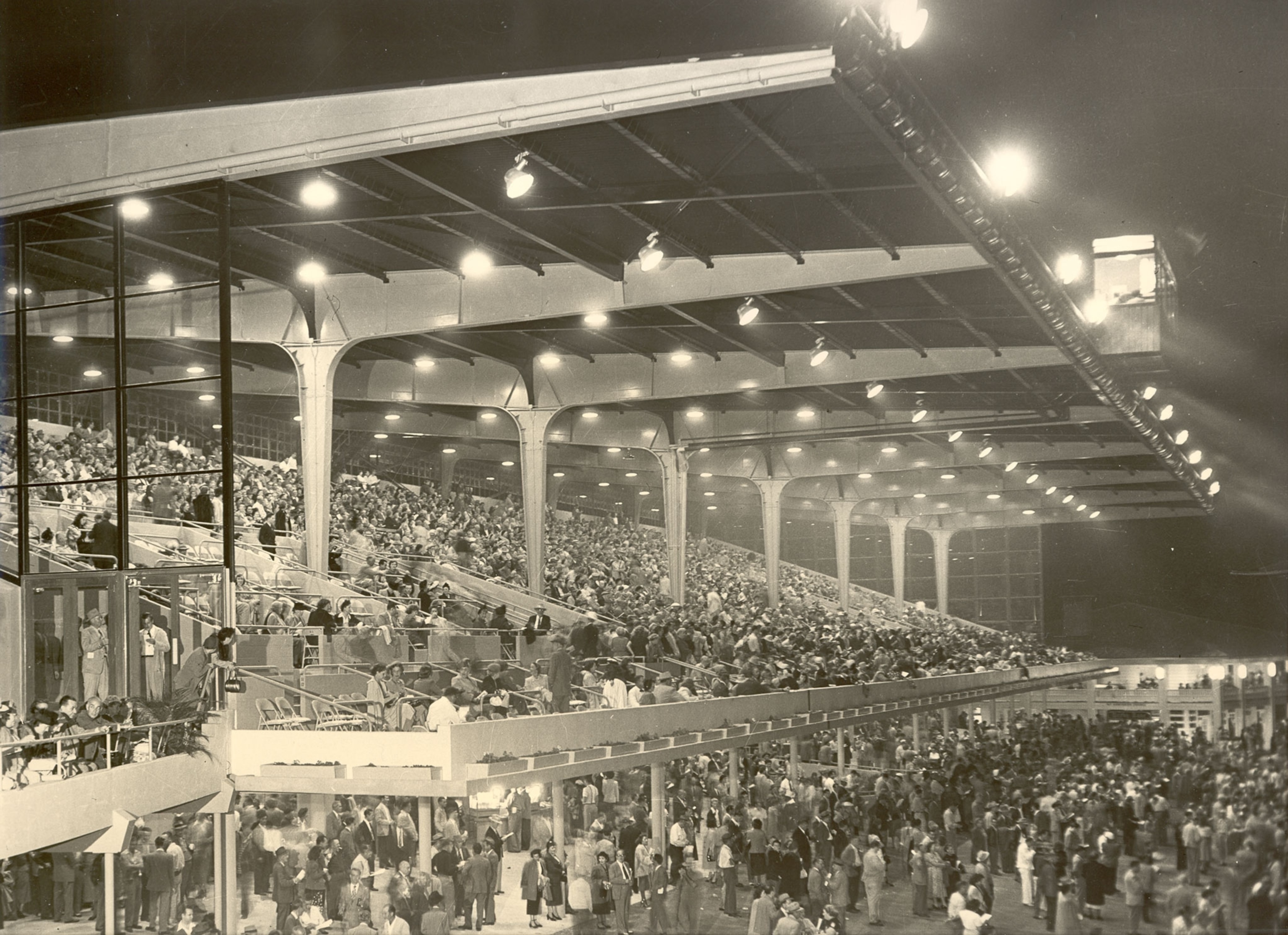 a stadium filled with people at night