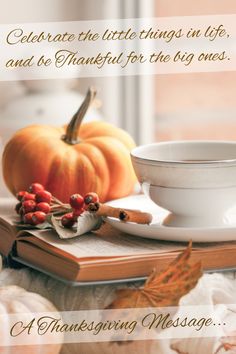 a thanksgiving message with a cup and saucer on a table next to pumpkins