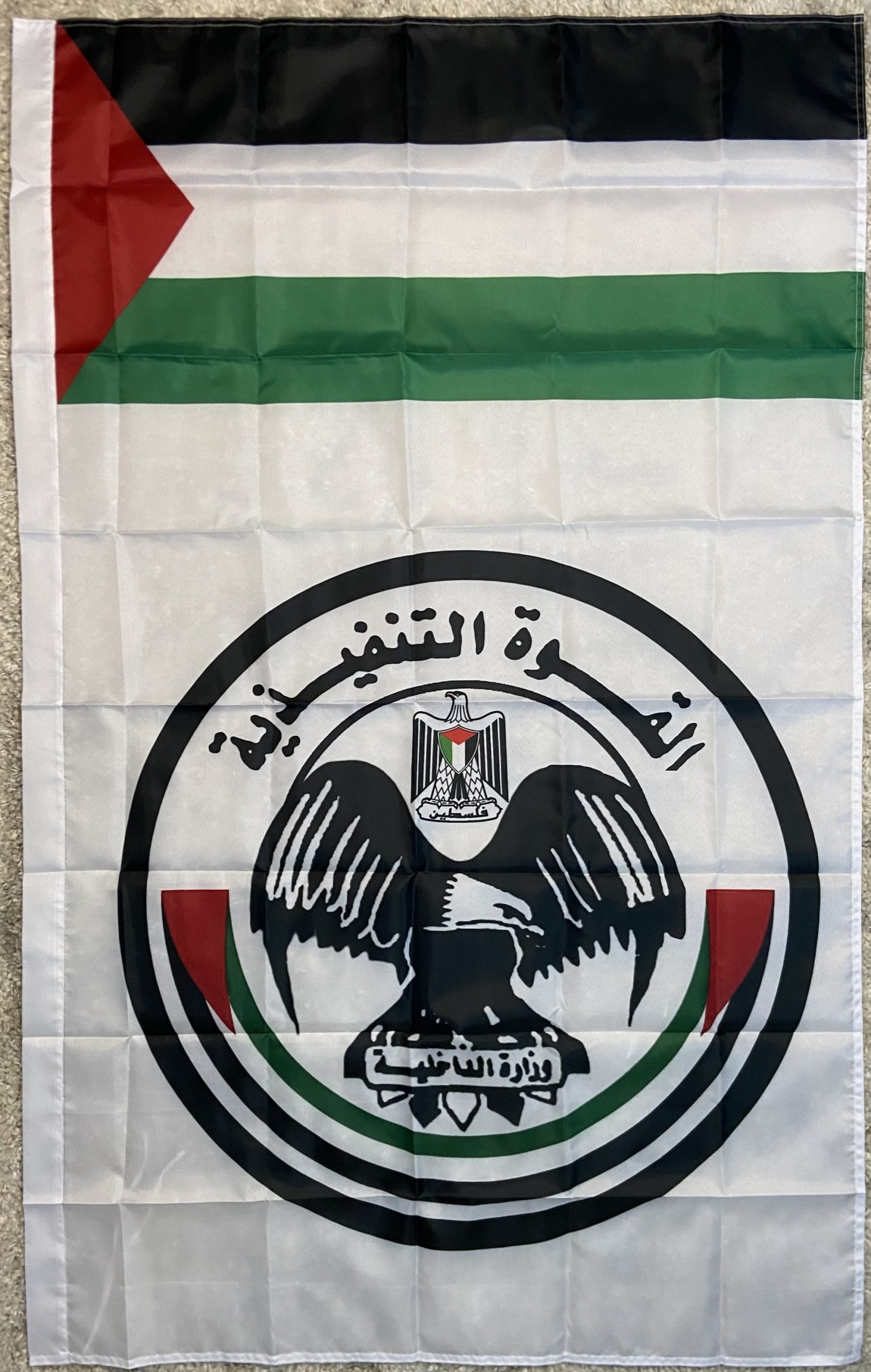 Introducing the Hamas Executive Force Flag, measuring 150 cm in height and 90 cm in width. This flag features the distinct design associated with the Hamas Executive Force, showcasing the iconic eagle emblem and the Palestinian national colors of black, white, green, and red. The text “السلطة التنفيذية” (Executive Authority) and “وزارة الداخلية” (Ministry of Interior) add to its authenticity. Crafted from high-quality polyester, this flag is perfect for collectors, historians, and reenactors who appreciate the detailed symbolism and historical significance of Middle Eastern flags. Whether displayed in a collection or used for educational purposes, this flag is a noteworthy addition for those interested in the history and politics of the region. Please note: This flag is not authentic and is intended for educational and collector purposes only.