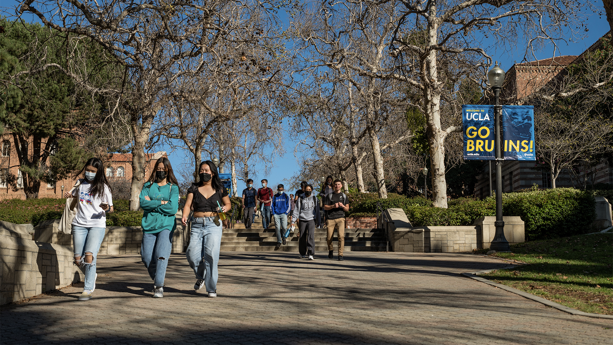 Students walk on the UCLA campus in Los Angeles on Feb. 18, 2022. Photo by Raquel Natalicchio for CalMatters