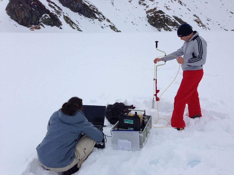 Scientists of the LimnoAlp consortium take physicochemical measurements of the water column of Lago Nero, an alpine lake in southern Switzerland, during winter