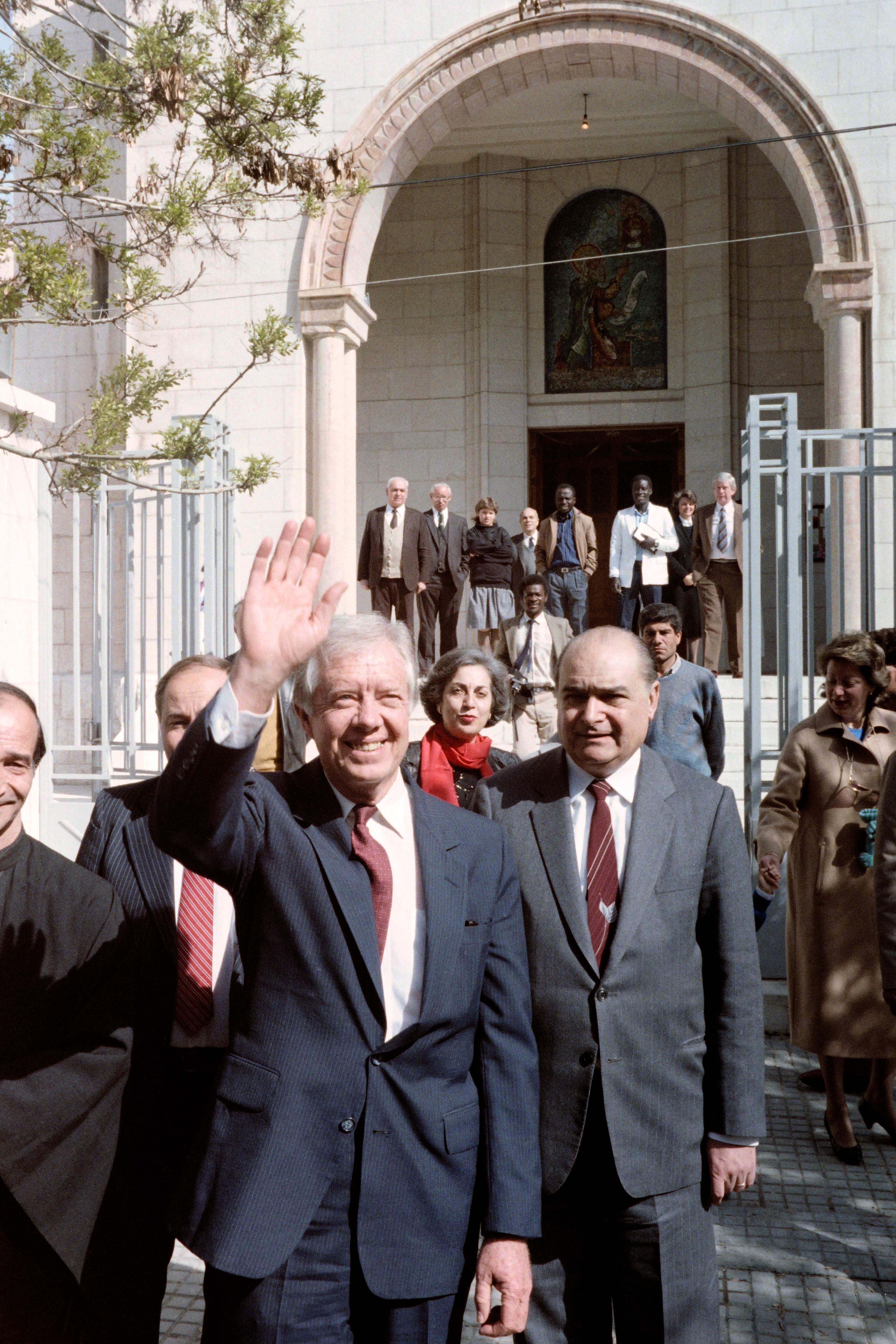 Photo taken on March 22, 1987 in Damascus shows former U.S. President Jimmy Carter leaving the Saint John Church during his trip to Syria. (Photo by /AFP/Getty Images)