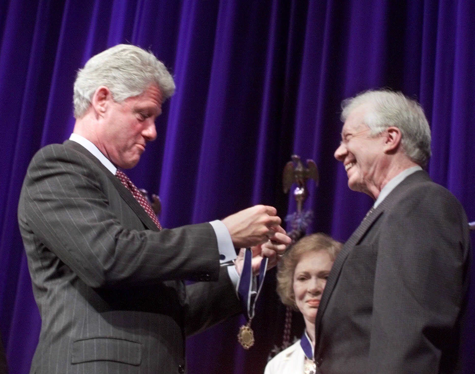 President Clinton presents former President and First Lady Jimmy and Rosalynn Carter the Presidential Medal of Freedom, the nation's highest civilian honor, during a ceremony at the Carter Center in Atlanta Monday, Aug. 9, 1999. (AP Photo/Susan Walsh)