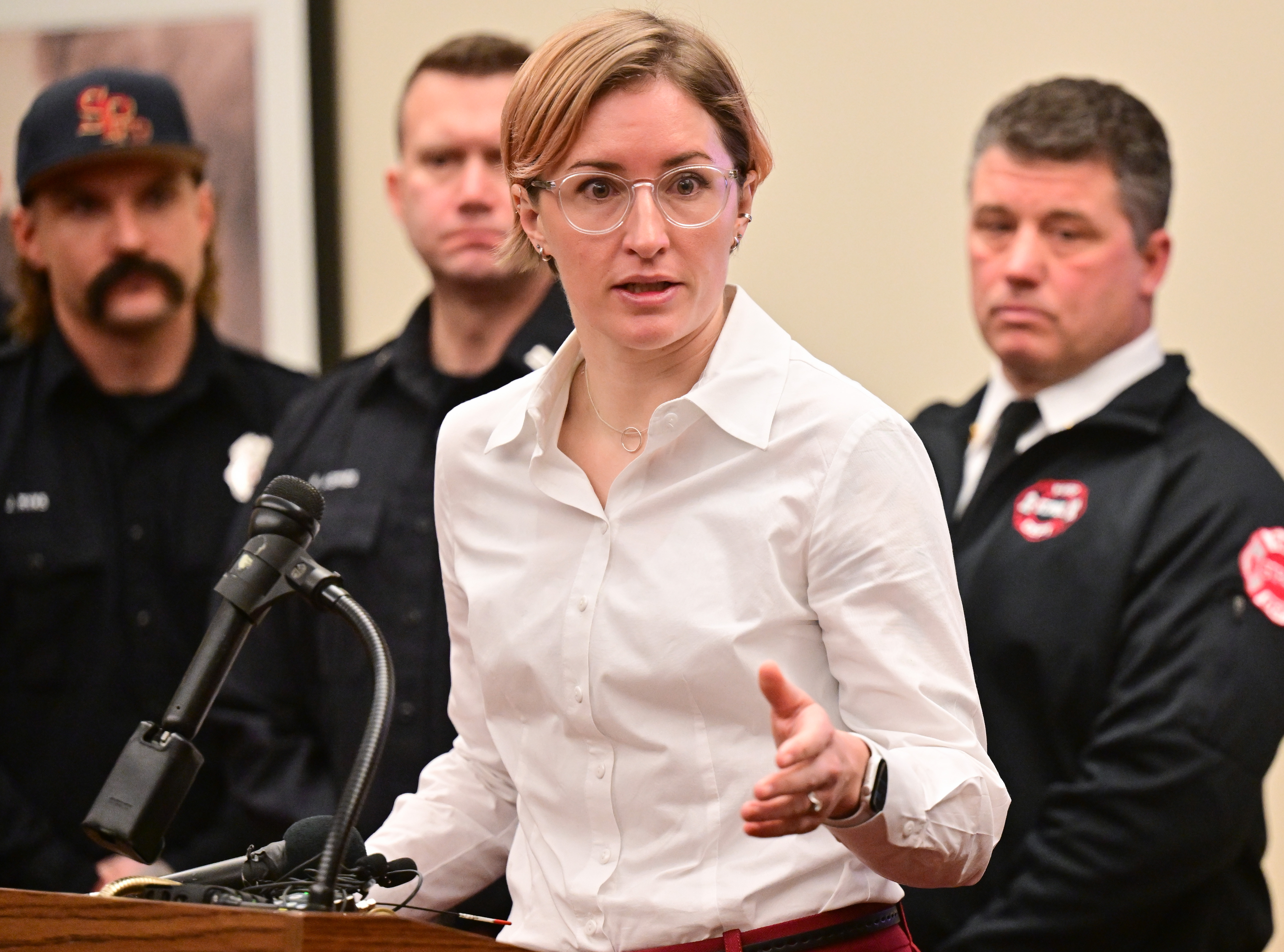 A woman speaks at a podium