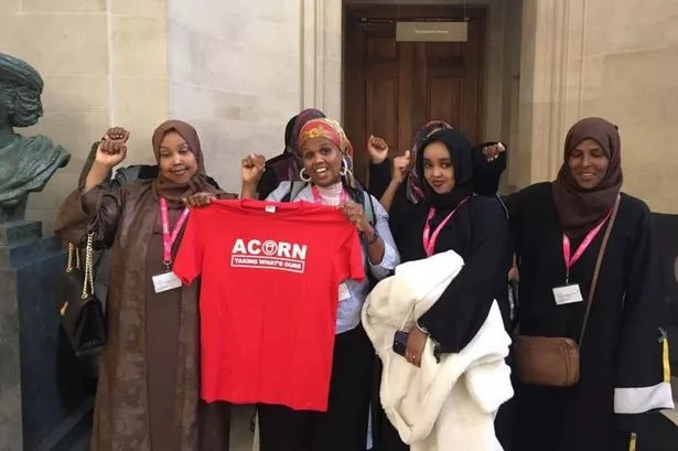 Female campaigners celebrate outside council meeting