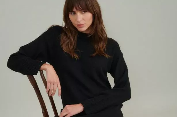 Shoppers can get the Black Crew Neck Knitted Midi Jumper Dress at both Nobody's Child and Marks & Spencer