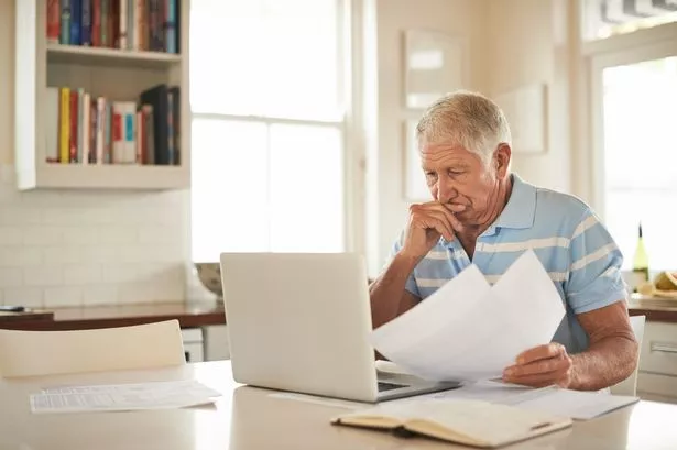 Older man worrying about bills