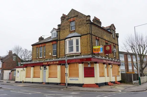 A boarded up pub which has gone out of business