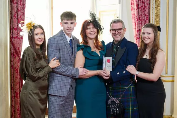 Chris visited Buckingham Palace with his wife Elaine, daughters Daisy and Heidi and his son Logan