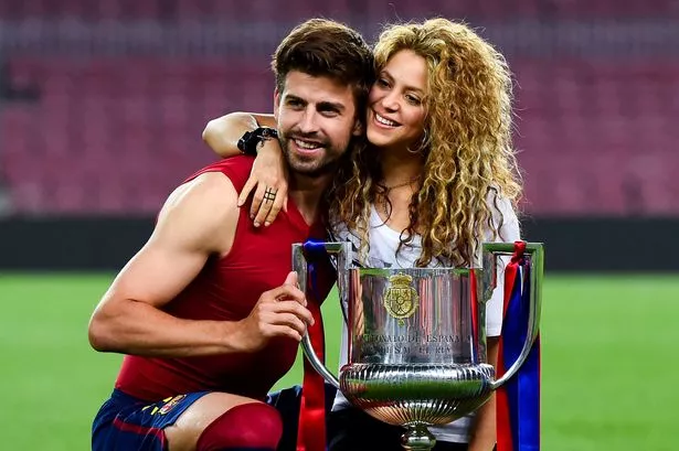 Gerard Pique of FC Barcelona and Shakira pose with the trophy after FC Barcelona won the Copa del Rey Final match against Athletic Club at Camp Nou on May 30, 2015 