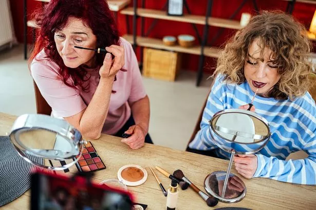 Mother and daughter make an online vlog about doing makeup at home