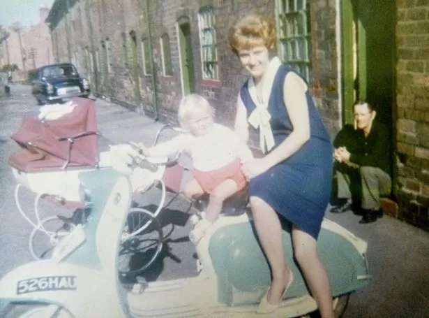 Alfred Swinscoe (R), is seen sitting on the step while his daughter Julie and grandson Russell are pictured on the motorbike