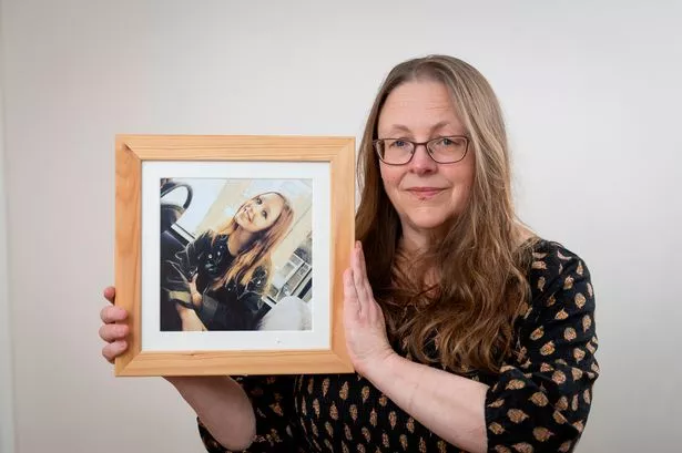 Ros Gross, with a picture of daughter Alice