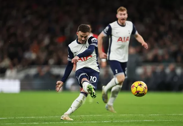 LONDON, ENGLAND - DECEMBER 22: James Maddison of Tottenham Hotspur scores his team's first goal past Alisson Becker of Liverpool (not pictured) during the Premier League match between Tottenham Hotspur FC and Liverpool FC at Tottenham Hotspur Stadium on December 22, 2024 in London, England. (Photo by Alex Pantling/Getty Images)