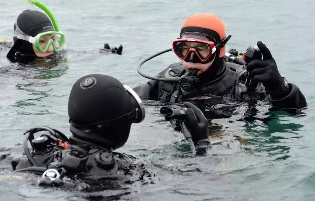 The diving customers didn't know he was searching for his wife