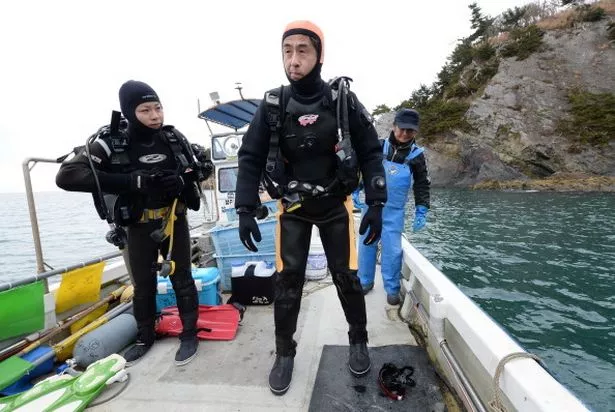 Yasuo Takamatsu preparing for another dive