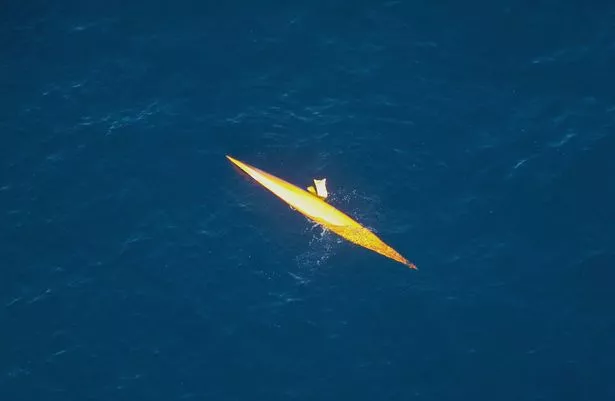 This photo provided by the Royal New Zealand Air Force (RNZAF) shows the upturned kayak of adventurer Andrew McAuley adrift in the Tasman Sea February 10, 2007 off Milford Sound, New Zealand from a bird's eye view