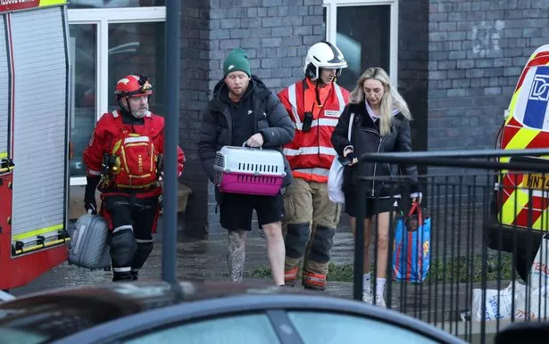 Residents being evacuated from the Meadow Mill building