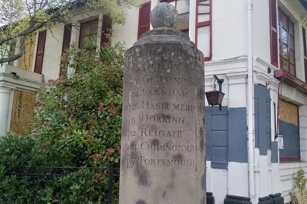 The White Lady Milestone, a grade II monument outside the former Cafe Rouge in Portsmouth Road, Esher