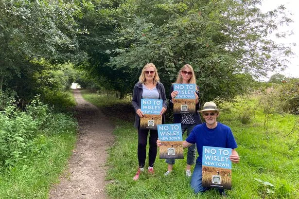 Frances Porter, Imogen Jamieson and Chris Campbell are against the plans for 1,700 new homes on Wisley Airfield