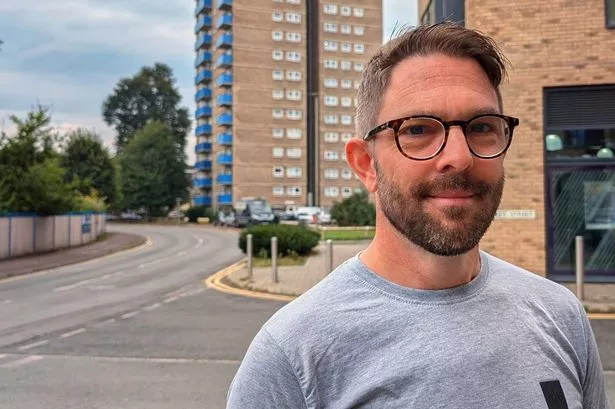 Councillor Steve Eldridge outside Addlestone One and Surrey Towers (Image Steve Bax)