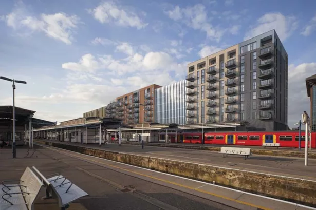 CGI view of proposed apartment blocks from train platform.