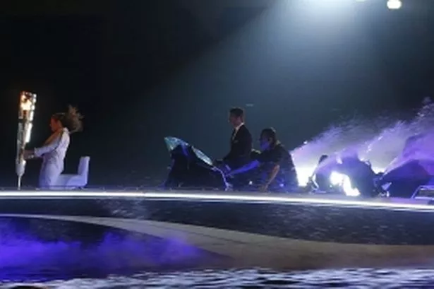 David Beckham (centre) driving the speedboat. Pic: Action Images/Reuters