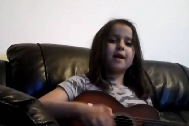 Undated handout video grab image issued by Surrey Police of Sara Sharif, 10, singing and playing a guitar