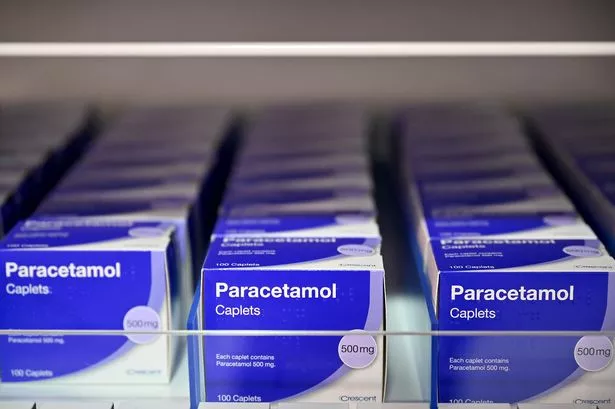 Packets of paracetamol on a shop shelf