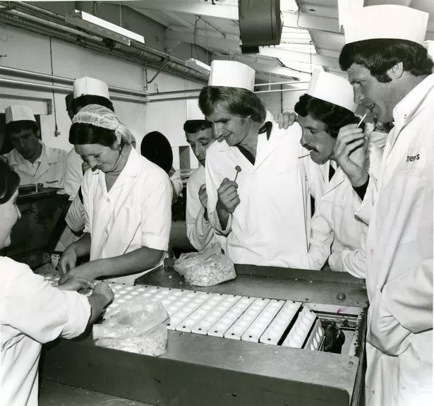 Liverpool FC stars visit Taverner sweet factory, seen here are Ian Callaghan, Phil Thompson, Terry McDermott and John Toshack watch the lollipop making process. September 3, 1976