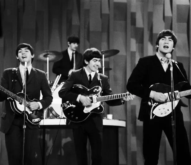 In this Feb. 9, 1964 file photo, The Beatles, from left, Paul McCartney, Ringo Starr on drums, George Harrison and John Lennon, perform for the CBS "Ed Sullivan Show" in New York, as they record a set that would later be shown on the Feb. 23 broadcast of the show.