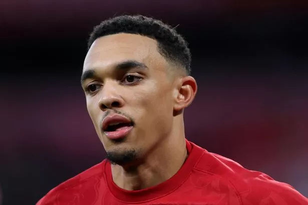 Trent Alexander-Arnold of Liverpool looks on as he warms up prior to the Premier League match between Liverpool FC and Manchester City FC at Anfield 